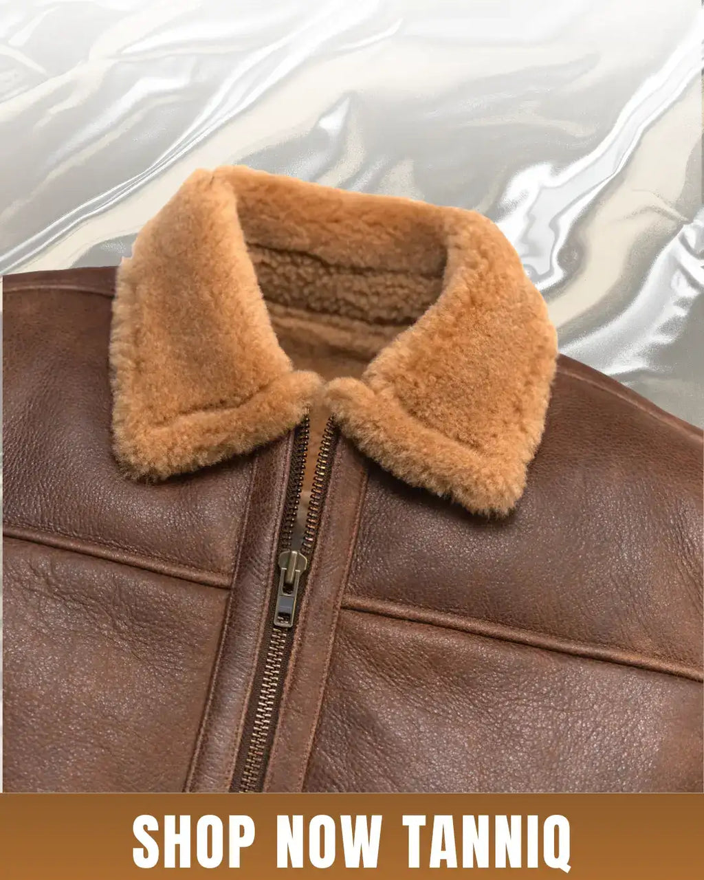 Brown leather jacket with fur collar on a white background, featuring 'Shop Now Tanniq' text.
