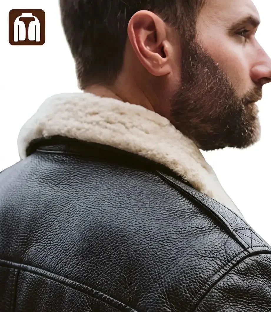 Close-up of a man wearing a black leather jacket with a white fur collar.