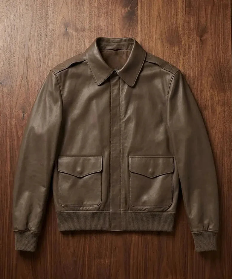 Brown leather jacket on a wooden surface