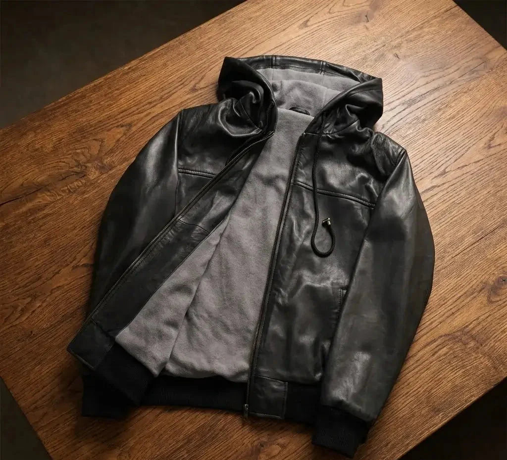 Black leather jacket on a wooden surface