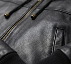 Close-up of a black leather jacket with zipper details