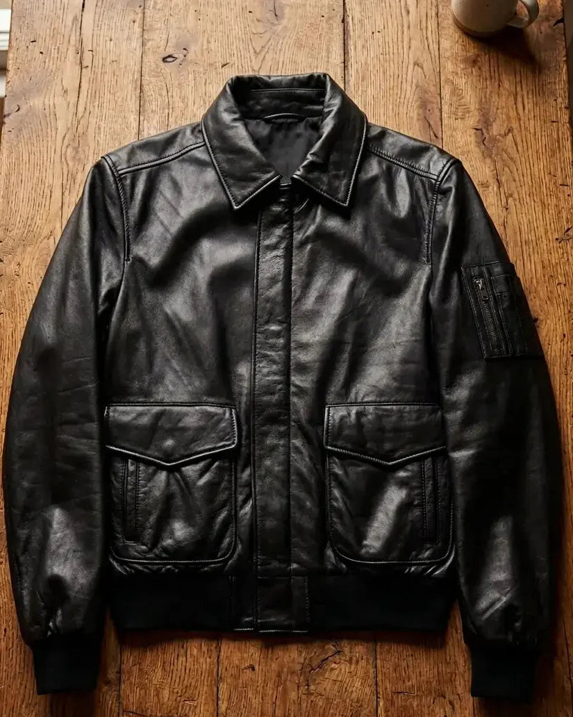 Black leather jacket on a wooden surface