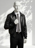 Mannequin wearing a black leather jacket and gray tie against a white background