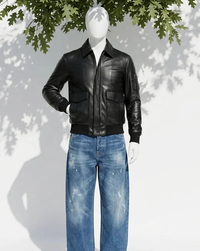Mannequin wearing a black leather jacket and blue jeans with a white background and tree shadow.