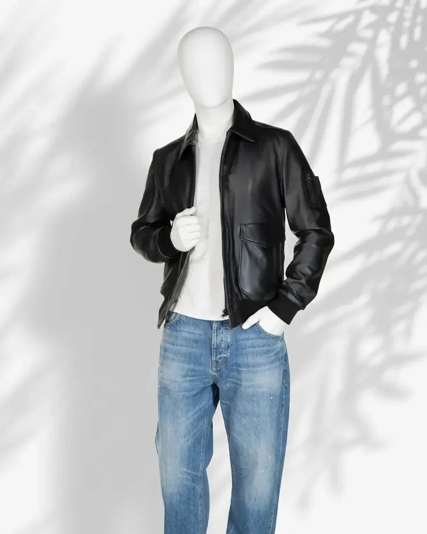 Mannequin wearing a black leather jacket and blue jeans on a white background