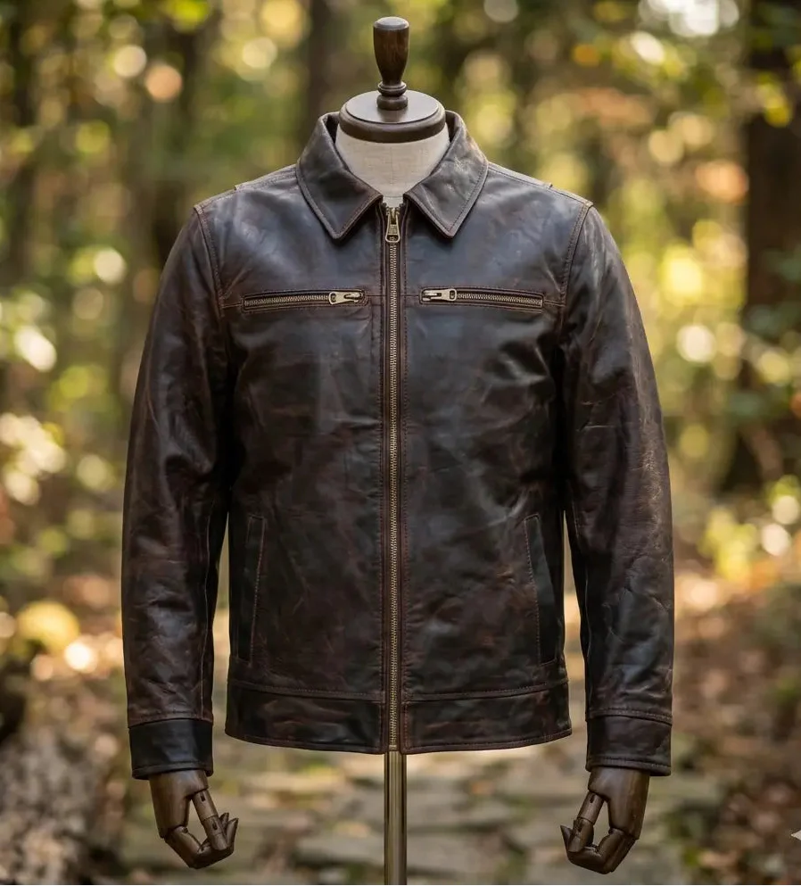 Brown leather jacket on a mannequin against a blurred forest background