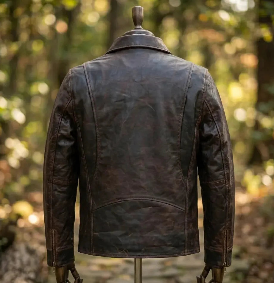 Brown leather jacket on a mannequin against a blurred natural background