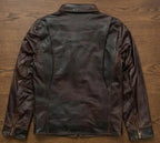 Brown leather jacket on a wooden surface