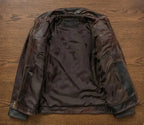 Brown leather jacket on a wooden surface