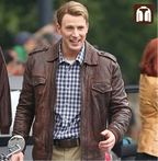 Man wearing a brown leather jacket and plaid shirt outdoors