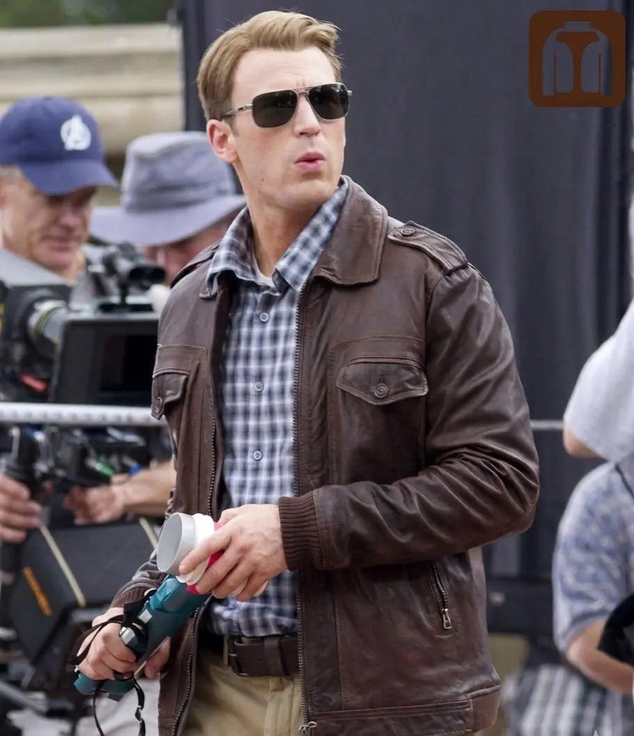 Man wearing sunglasses and a brown jacket on a film set
